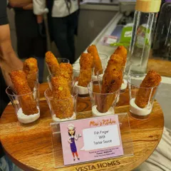 Crispy Fish Fingers served with Tartar Sauce in individual shot glasses. This modern presentation is perfect for cocktail parties and makes for easy, mess-free eating.