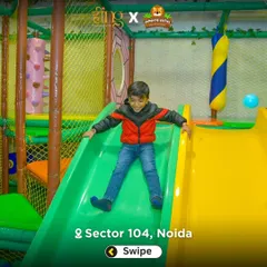 This young boy is all smiles as he zips down one of our fast and fun slides. The entire structure is enclosed with safety nets for worry-free play.