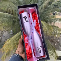 Toast to your love with these personalized non-breakable champagne flutes. Engraved with your names, they come in a beautiful gift box, making them a perfect anniversary or wedding gift.
