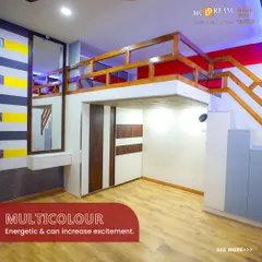 This energetic kid's room uses a multi-color theme with bold stripes of yellow, grey, and red. The loft design maximizes floor space for play, while the integrated wardrobe provides ample storage.