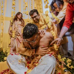 The groom's friends and family playfully applying haldi, a moment of pure fun and chaos that we love to capture.