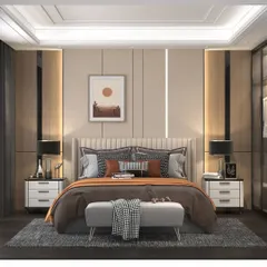 This modern bedroom design uses a warm, neutral color palette. The room features a fabric headboard, stylish bedside tables, and accent lighting within the wall panels and false ceiling to create a relaxing ambiance.