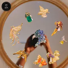 These aren't your average brooches. I source and design unique, artistic pins and brooches that act as wearable art, from golden phoenixes to colorful parrots. Each piece is a conversation starter, perfect for elevating a simple jacket or dress.