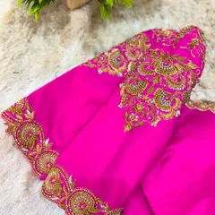A stunning rani pink blouse with heavy gold zardosi and stonework on the sleeves. This is the kind of statement piece that elevates any silk saree.