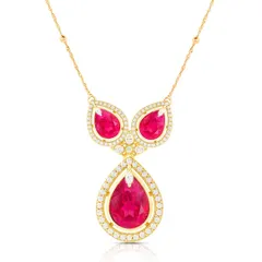 A stunning ruby and diamond necklace photographed on a white background, with precise lighting to capture the sparkle of the gems and the shine of the gold.