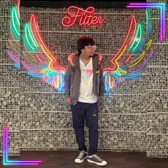 Another shot with the neon wings, this time with a more thoughtful pose. It represents the idea of being wise, seeing more, and talking less.