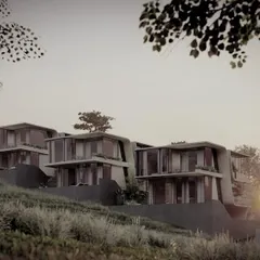 The Moira Homes project, seen here at dusk, sits atop a gentle slope in Goa. The design uses the elevation to its advantage, creating terraced levels that give each home privacy and an expansive view of the landscape.