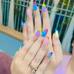 A creative take on French tips with a multi-color gradient on each nail. This design is vibrant, artistic, and perfect for those who love color.