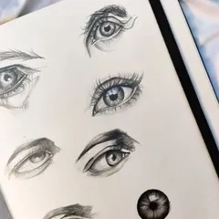 A page full of eye sketches. The eyes are one of my favorite things to draw, and I'm always practicing different shapes, styles, and expressions.