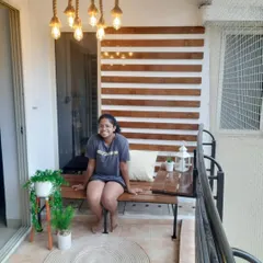 Here is one of our happy clients enjoying her new custom pinewood bench. It’s the perfect spot to relax and enjoy the beautiful balcony we created.