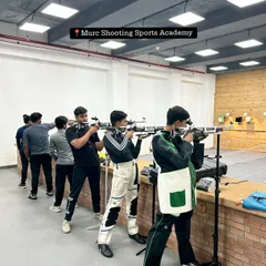 A typical training day at our academy. Shooters of all levels line up to practice, creating an environment of shared focus and dedication.