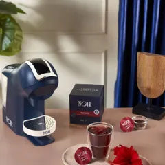 Another shot for Noir, this time showcasing their hibiscus tea pods. The styling incorporates a fresh hibiscus flower to visually communicate the flavor.