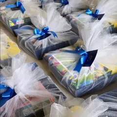 Unwrapping love, one gift at a time. Our elegant Trousseau Hampers are beautifully wrapped in delicate netting with satin ribbons, perfect for the most special moments.