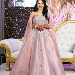 A full-length view of the lilac gown, showing its beautiful flare and elegant drape. This is a perfect example of the modern, stylish pieces we have for rent.