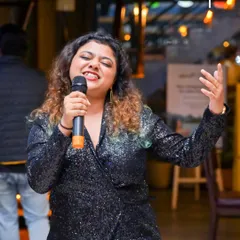 This singer is completely in the zone, pouring her heart into the performance. I provide a massive song library so you can always find that one track you love to sing.