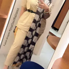 A closer look at the fusion drapes. The way a dupatta is belted and styled can completely change the silhouette and impact of an outfit, making it a powerful styling tool.