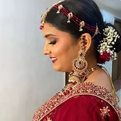 The complete look for this stunning bride, showcasing her radiant smile and the flawless makeup that will last through all the wedding day festivities.