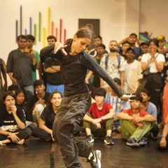 A b-girl shows her style and flow during a battle. Our events are a space where female dancers can confidently showcase their skills and artistry.