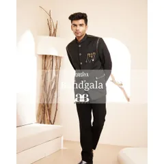 Our black Bandhgala, styled to show its versatility and modern appeal. The sharp cut and unique details make it a standout piece.