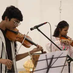Two of our violin students perform a duet on stage, their focus and skill on full display. The showcase gives them a platform to share the beautiful music they have practiced so diligently.