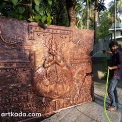 This is a large 3D embossed mural of a Kathakali dancer. The texture and depth bring the powerful expression of the art form to life. Here, I am giving it a final wash before delivery.
