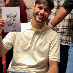 The smiles say it all. This guest is clearly happy with his exaggerated, fun portrait.