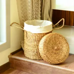 Our lidded laundry basket is woven from natural seagrass and includes a removable cloth liner. The sturdy handles and lid make it a practical and attractive solution for keeping laundry tidy in bedrooms or bathrooms.