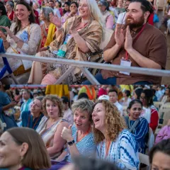 Devotees from our global community enjoying the Maha Shivratri celebration. Their expressions of joy and wonder show that the language of devotion is universal.