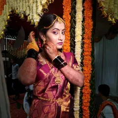 A candid moment from the ceremony. The makeup is designed to look stunning from every angle, even in the middle of the wedding rituals.