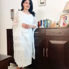An all-white embroidered kurta set is the epitome of summer elegance. The sheer dupatta adds a layer of grace. This is a timeless look that works for so many occasions.