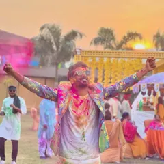Soaked in the colors of happiness at a Holi carnival. I don't just host from the sidelines; I immerse myself in the festival spirit to ensure everyone feels the joy.