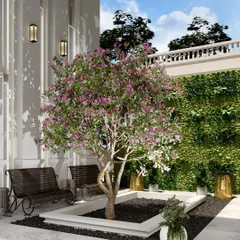 We design outdoor spaces to foster a deeper connection between humans and nature. This courtyard features manicured landscapes and inviting seating areas, offering a tranquil retreat for relaxation or social interaction under a flowering tree.