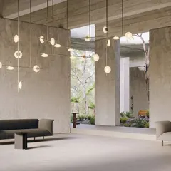 A large, sprawling installation of the Ceto system by Ross Gardam mimics the rippling surface of the ocean. The various orientations of the mouth-blown glass discs create a dynamic play of light that is both sculptural and captivating.
