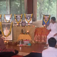 A teacher shares stories of Sri Krishna during our Janmashtami celebration. These events are a beautiful blend of devotional kirtan, deep meditation, and inspiring satsang to honor the divine presence.