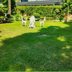 This wide view showcases the scale of our landscaping projects. We design layouts that balance open lawn spaces with curated planting and seating areas for a complete outdoor living experience.