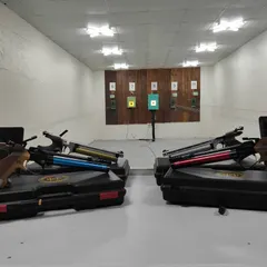 A selection of high-quality air pistols in their cases, ready for use at the range. I offer a variety of equipment to suit different preferences.