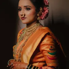 A classic three-quarter portrait of the bride, Jagruti. The soft lighting and her thoughtful expression create a timeless and elegant image.