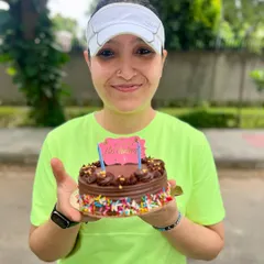 We believe every achievement, big or small, deserves a celebration. Here's one of our members celebrating her birthday with a post-run cake cutting, because we're a family that sweats and celebrates together.
