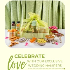 Celebrate love with my exclusive wedding hampers. This hamper, wrapped in a delicate potli, is surrounded by a colourful array of traditional sweets and snacks, perfect for gifting during the wedding season.