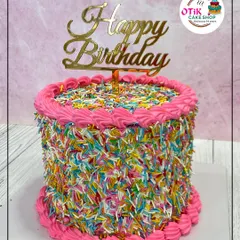 For the fun-loving spirit, our sprinkle cake is a burst of color and happiness. Covered entirely in rainbow sprinkles with a bright pink border, this cake is designed to be the life of the party.