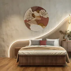 We designed this bedroom around organic forms and tactile surfaces. The custom-designed, wave-like headboard with integrated backlighting creates a soft, sculptural feature wall, complemented by the textured plaster and warm wood tones for a serene atmosphere.