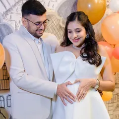 A heartwarming moment with her partner. The makeup is designed to look fresh and natural, capturing the love and excitement of this special time.