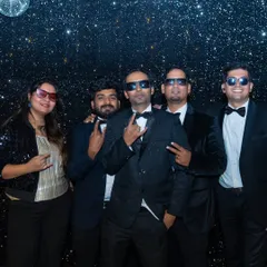 The band, dressed in tuxedos, posing for a shot during a "Great Gatsby" themed New Year's Eve party. We adapt our style to fit the theme of any high-profile event.