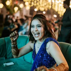 The bride's infectious energy as she cheers during a Sangeet performance, a perfect example of the candid, joyful moments I love to capture.