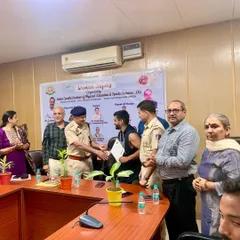 Shaking hands with the Assistant Commissioner of Police after contributing to a workshop on women's safety. It is an honor to use my skills to serve the community.