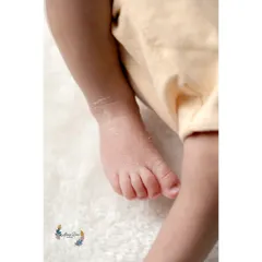 Another angle focusing on the delicate toes and soft skin of a newborn's foot. These macro shots are perfect for remembering every single detail.