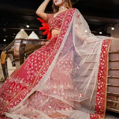 Capturing the full splendor of a bridal lehenga is key. This shot showcases the entire ensemble, from the detailed embroidery to the flowing dupatta, creating a powerful image for any bridal couture lookbook.