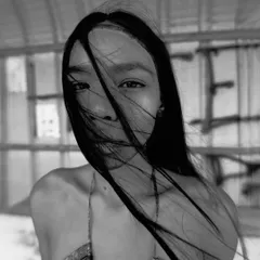 A captivating black and white close-up from the 'Nazaar' series, with the model's hair creating a veil across her face.