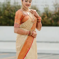 A full portrait of my beautiful bride, showcasing her complete traditional look. The perfectly draped Kanjivaram saree, temple jewellery, and radiant makeup come together to create a picture of timeless grace.