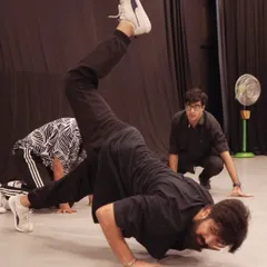 An energetic freeze-frame from a hip hop routine. This captures the power and athleticism that dance demands.